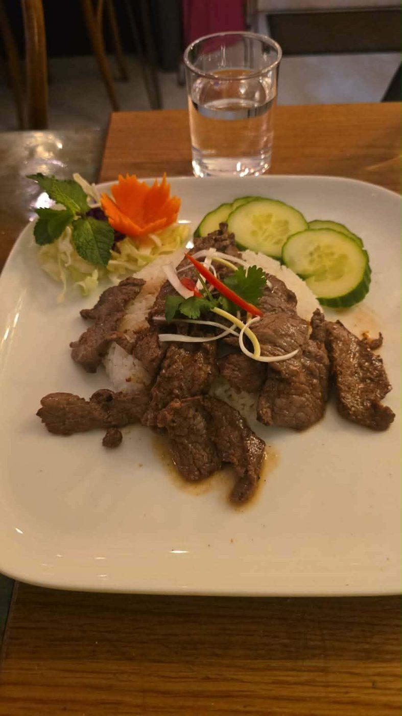 Stir-fried beef with jasmine rice, fresh salad and carved carrot