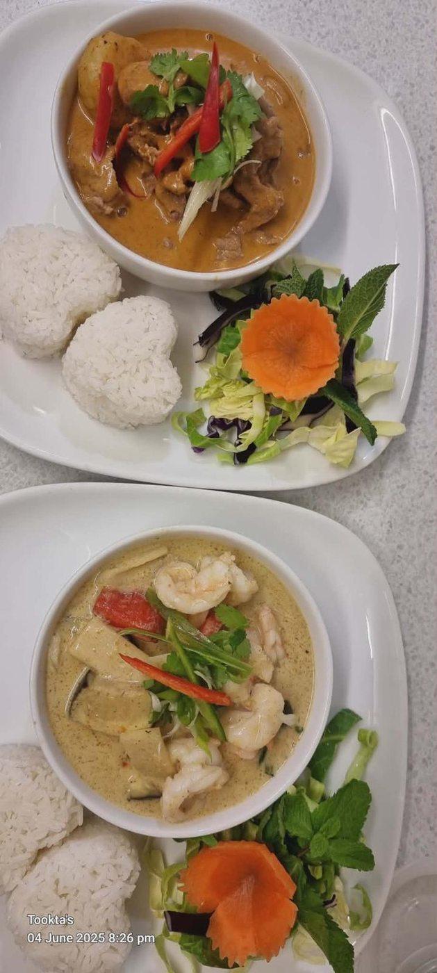 Tookta's curries served at the table — red curry and green prawn curry